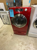 Red Samsung frontload Gas Dryer on a pedestal