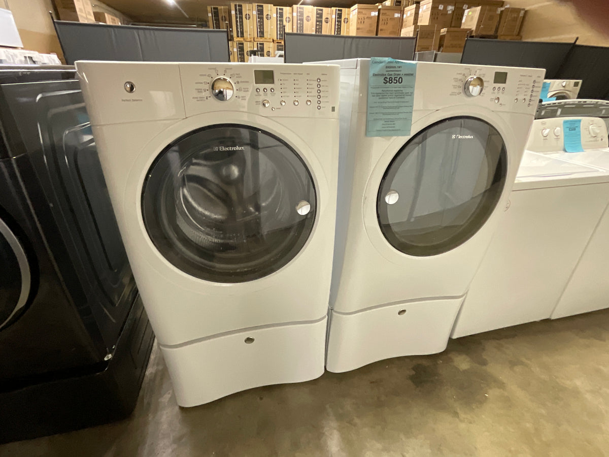 Frontload Electrolux Gas washer dryer set on Ped